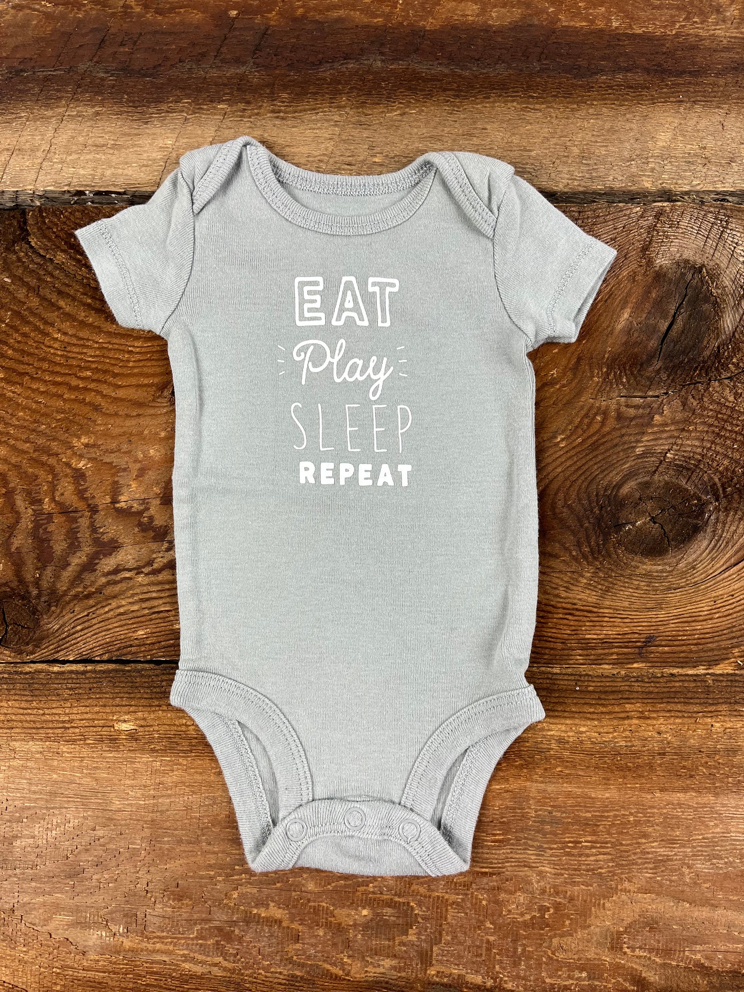 Carter’s NB Eat Play Sleep & Repeat Onesie